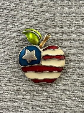 Vintage AJMC marked silver tone American flag apple brooch